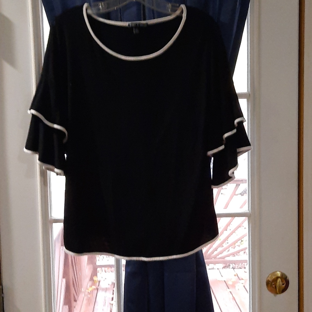Black three quart sleeve ruffled trim in white